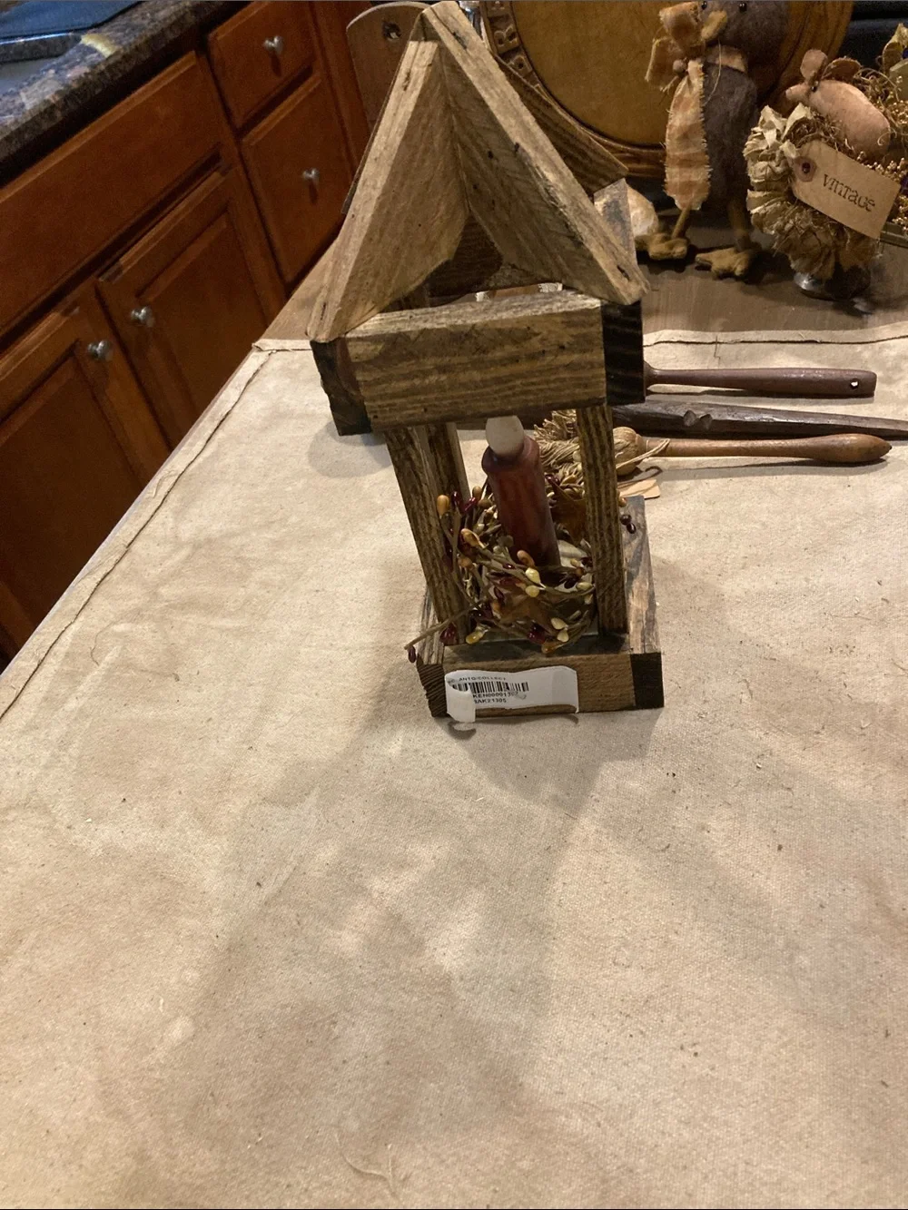 Rustic Wooden Lantern with Red Candle Accent
